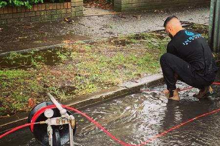 Man unblocking sewer